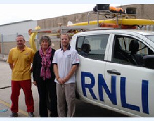 Formby beach first aid casualty Vicki Crennell with (left) RNLI lifeguard Tony ONeil and (right) RNLI Lifeguard Supervisor Pete Rooney.