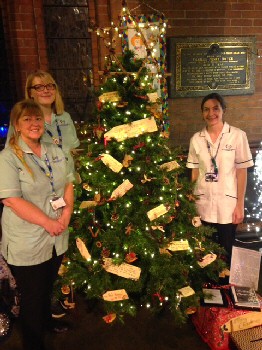 Photo (LtR): Cheryl Johns (occupational therapy technical instructor), Leah Russell (occupational therapy technical instructor) and Rachael O?Sullivan (specialist occupational therapist) at Hoylake Christmas Tree Festival.