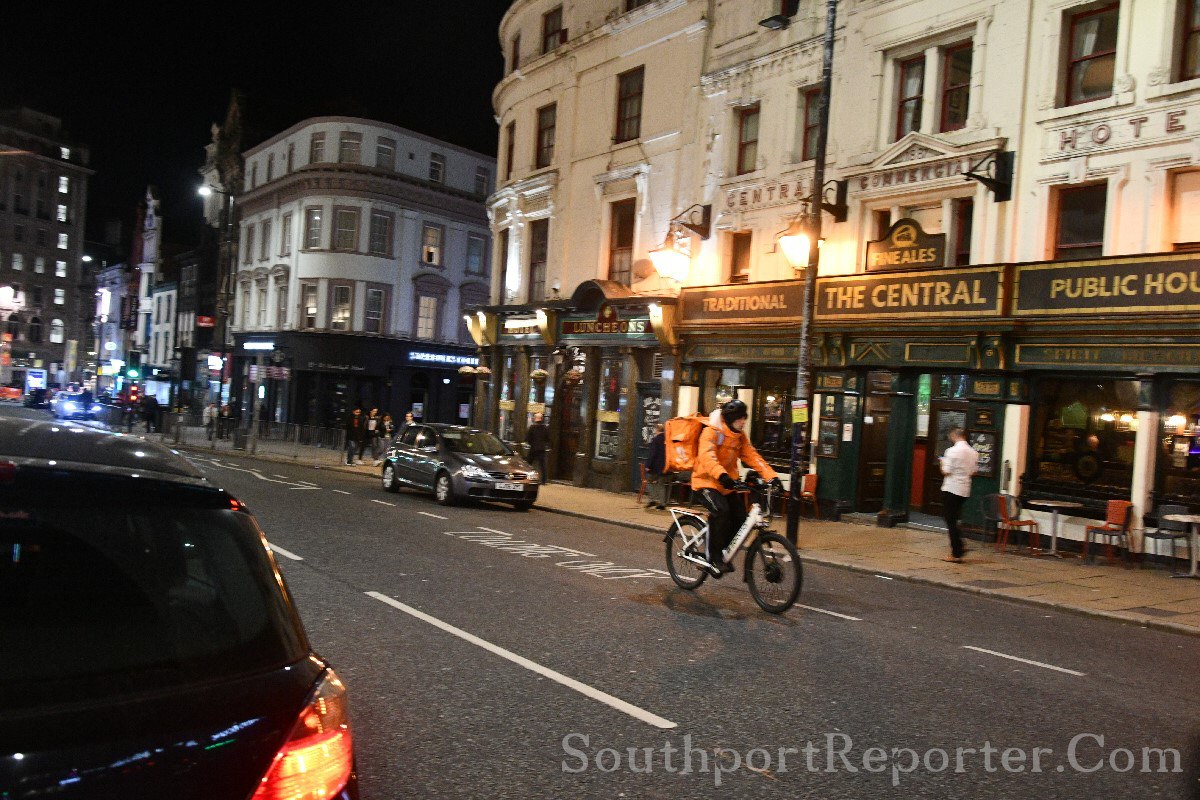 Cyclist with no lights at night.