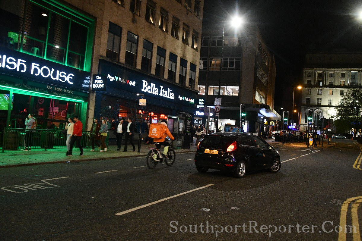 Car overtaking and cyclist without lights.