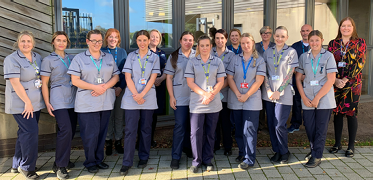 The 10 successful student Nurses celebrate coming through the internship. L-R: Kelly Devine, Anna Clarke, Zoe Teevan, Beverley Tunstall (Clinical Skills Lead Nurse - Knowsley), Emma Randles, Claire McEntegart (MCFT Assistant Director of Nursing - Lead for the project), Niamh Richards, Mel Sherlock, Hannah Simpson, Karen Deane (Practice Education Facilitator), Charlotte Cassidy, Lisa Leather (district Nurse), Kim Bridson, Lee Caruthers (Practicce Education Facilitator) Lucy Rose, Joanna Lavery (Senior Lecturer and District Nurse Programme Lead at LJMU