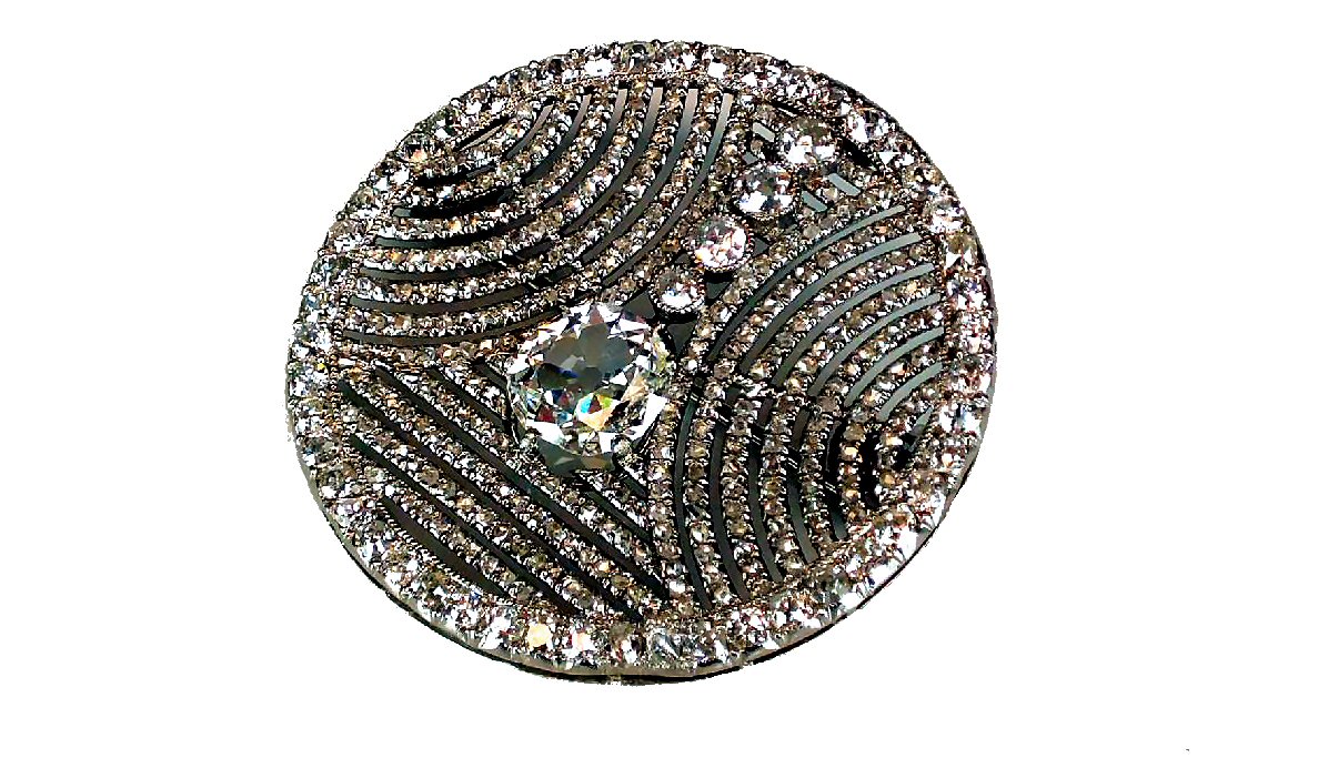 The Cartier diamond brooch valued at up to:- 6,000.