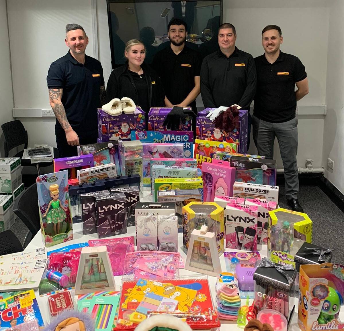 Group - InsureTaxi Branch Director Karl Garcia - (right) with team leader Ian Brooks, sales executives Lauren Burdell and Ben Pilgrim and collection organiser Jo Birch