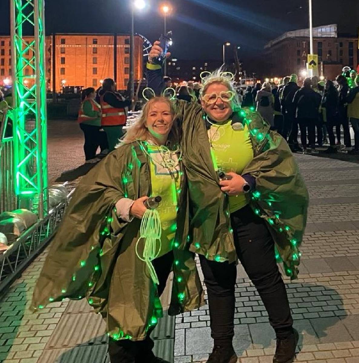 Geraldine Abbott, right, with her sister on this year's Glow Green Night Walk.jpg