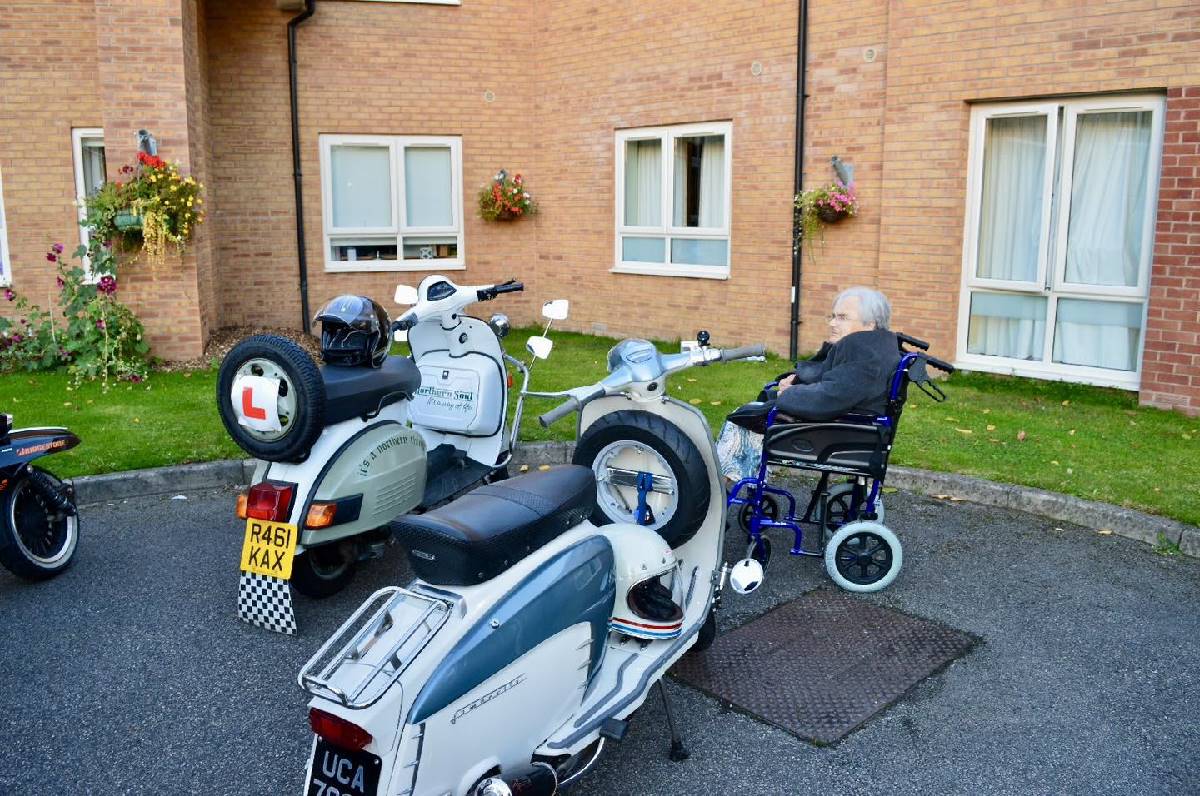 Elizabeth admiring the scooters.