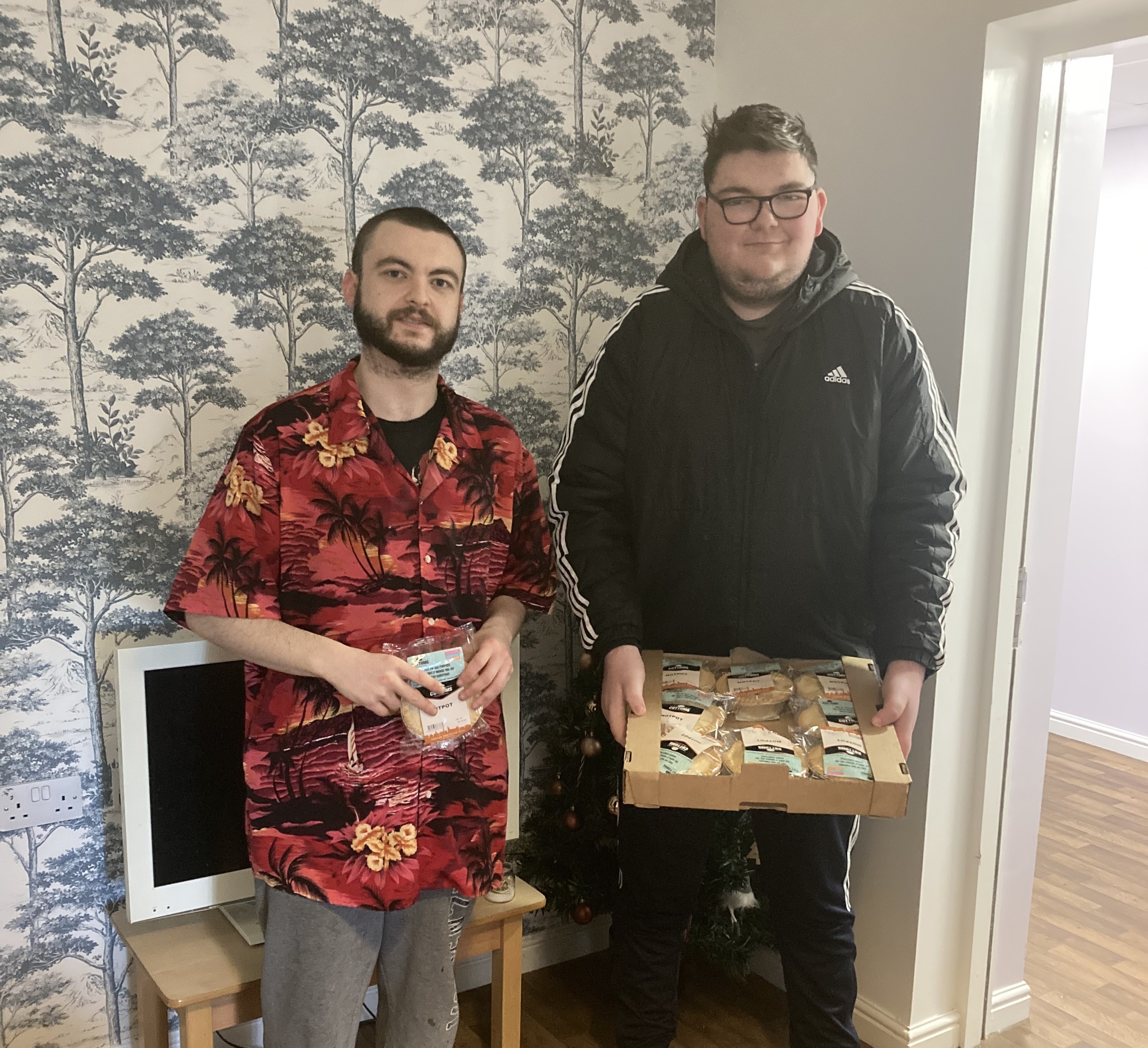  James and Jake, supported by Community Integrated Care in Southport, delighted to receive Cottom's pie donation to their service.